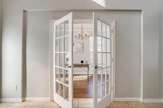 a view of a livingroom with furniture and a chandelier