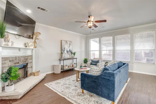 a living room with furniture and a fireplace