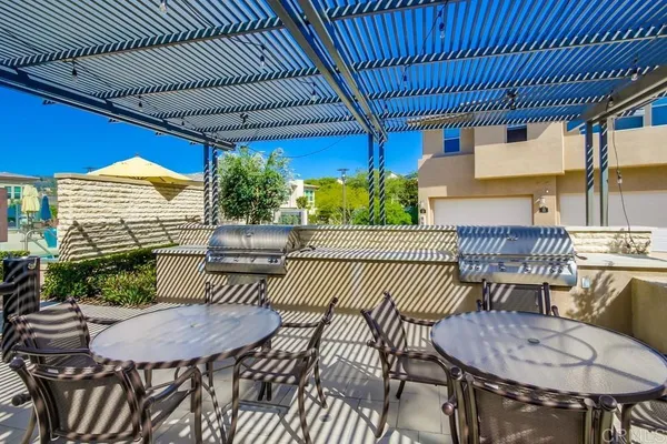 a outdoor dining space with furniture