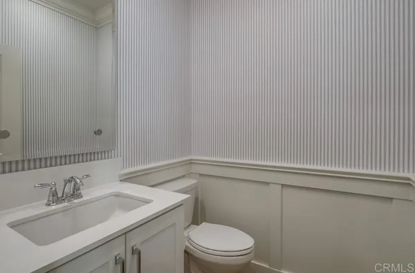 a bathroom with a sink toilet and vanity
