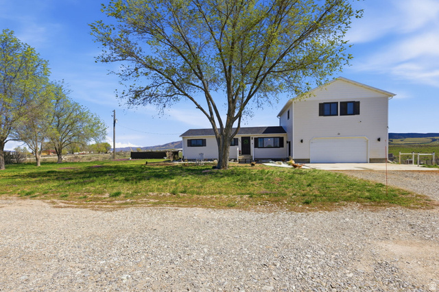 830 North Stone Road Snowville, UT 84336 - Photo 57 of 69 View of front of property with driveway and an attached garage
