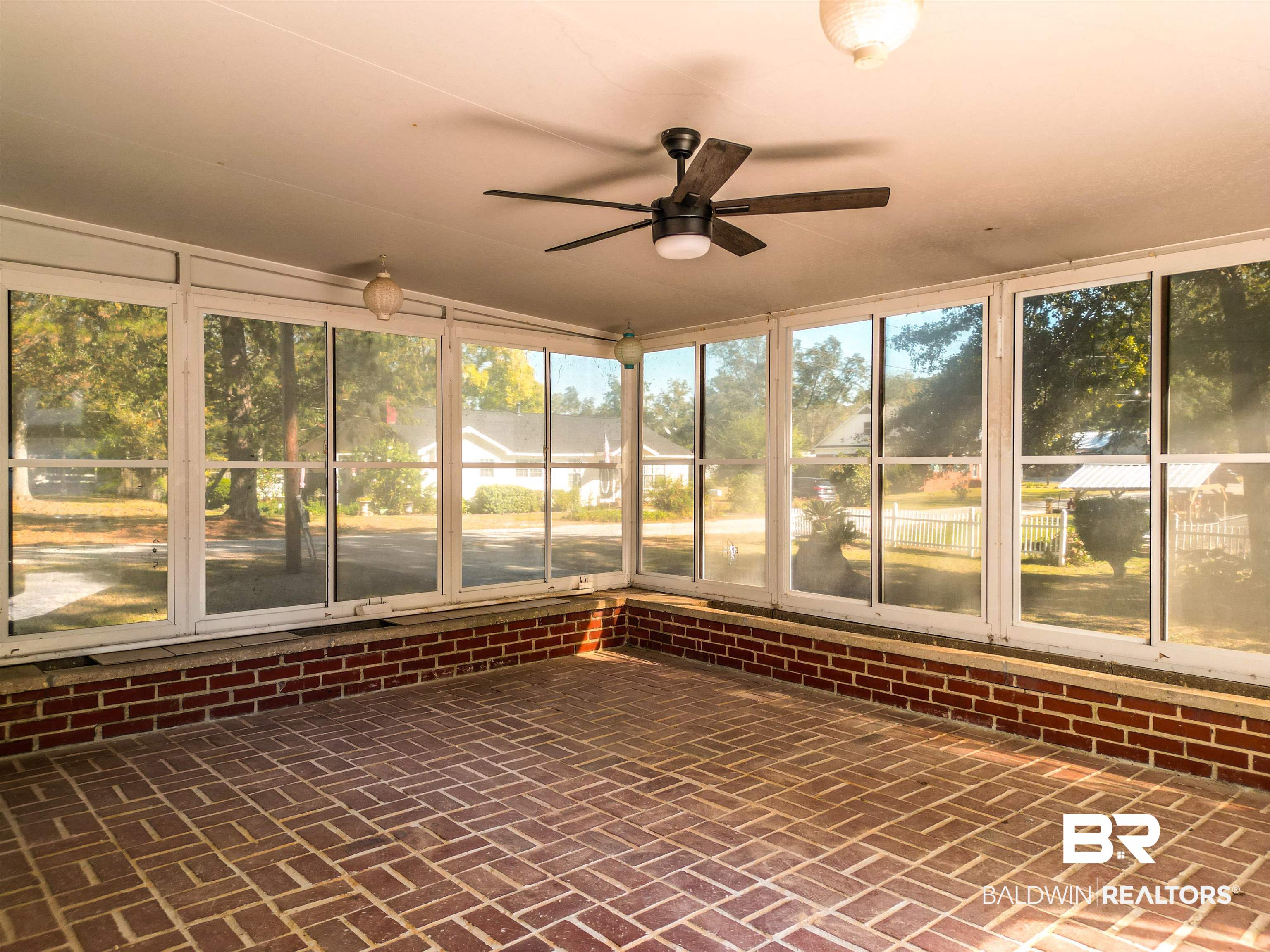 73 Liberty Street Monroeville, AL 36460 - Photo 28 of 29 Unfurnished sunroom featuring lofted ceiling and ceiling fan