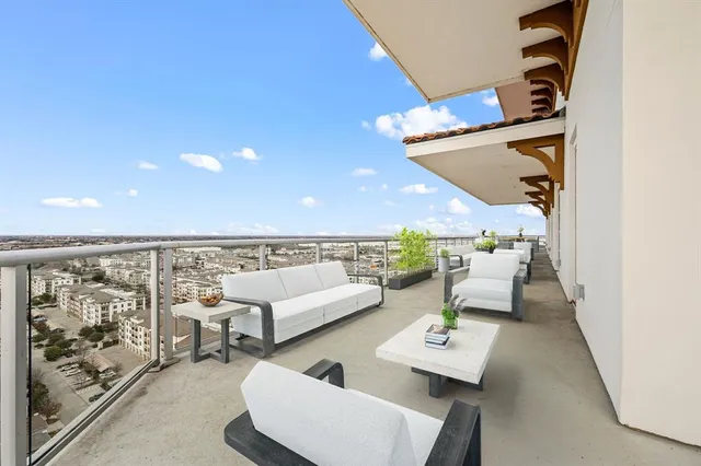 a dining room with furniture and chandelier