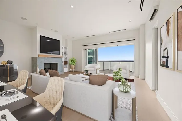 a living room with furniture fireplace and a flat screen tv