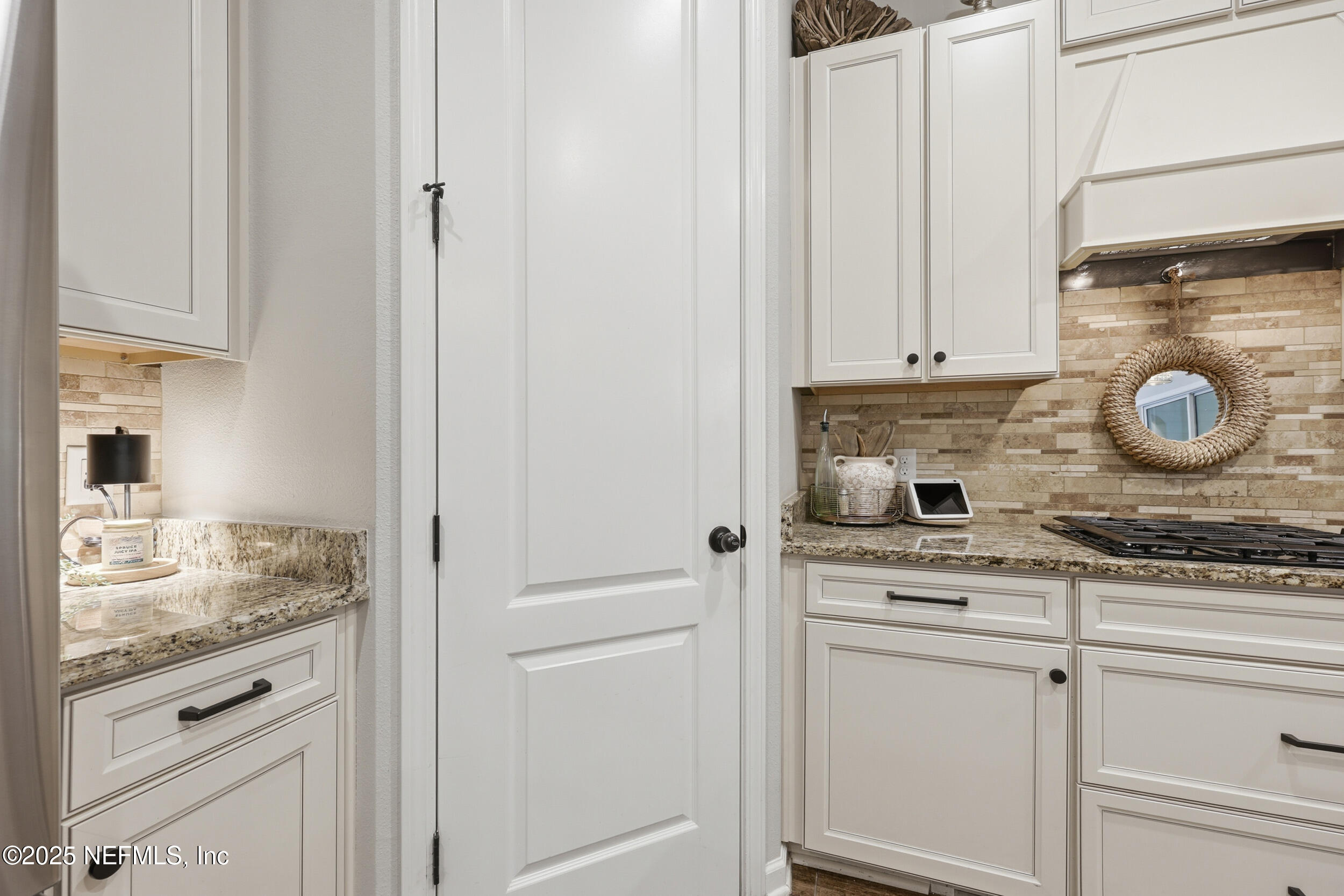 50 Olivette Street St. Johns, FL 32259 - Photo 17 of 74 a kitchen with granite countertop white cabinets and white appliances