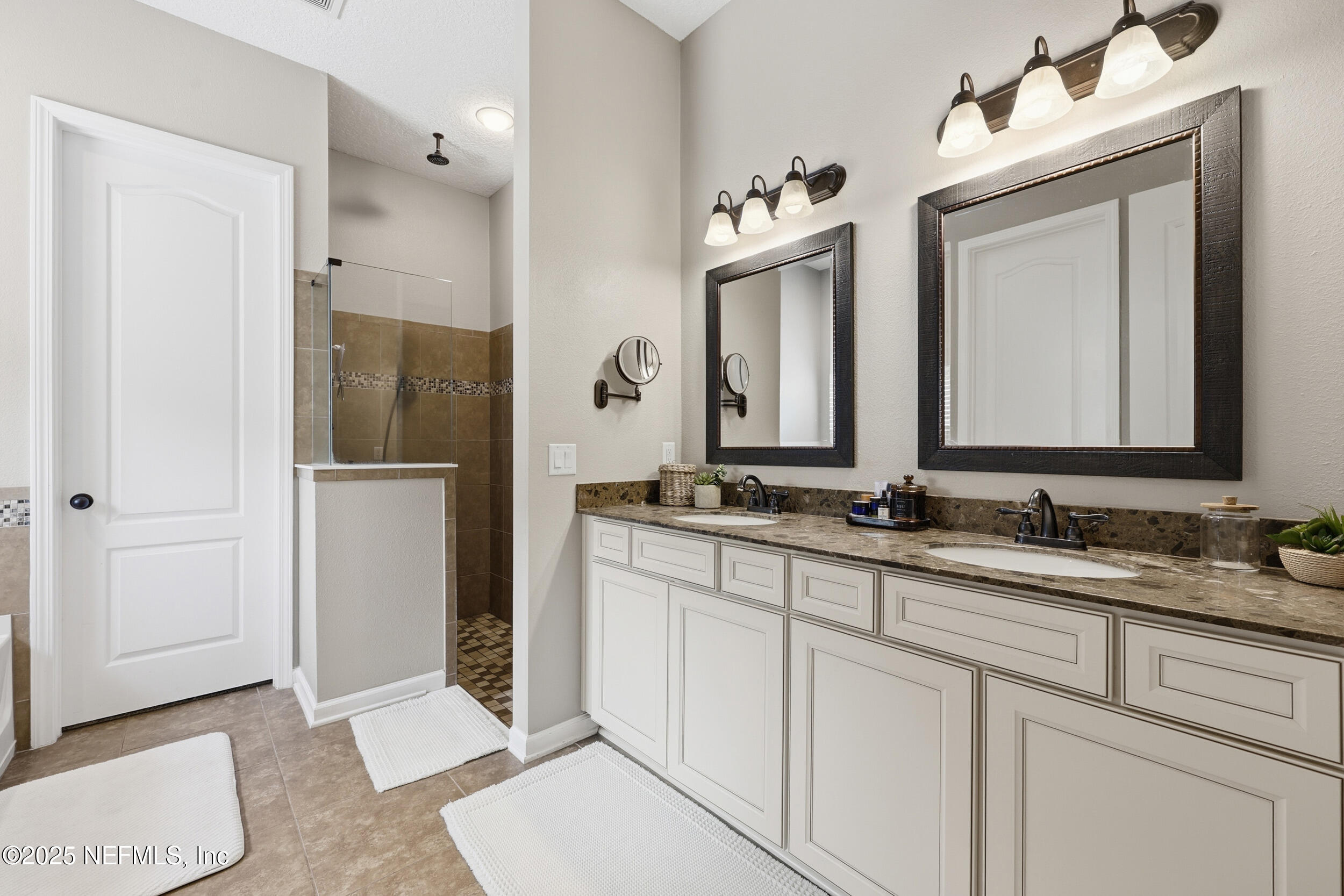 50 Olivette Street St. Johns, FL 32259 - Photo 27 of 74 a bathroom with a double vanity sink and mirror