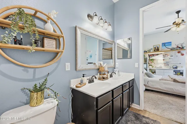 a view of a livingroom with workspace and a flat screen tv