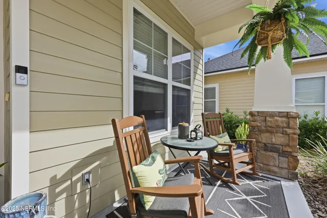 a view of an entryway with wooden floor