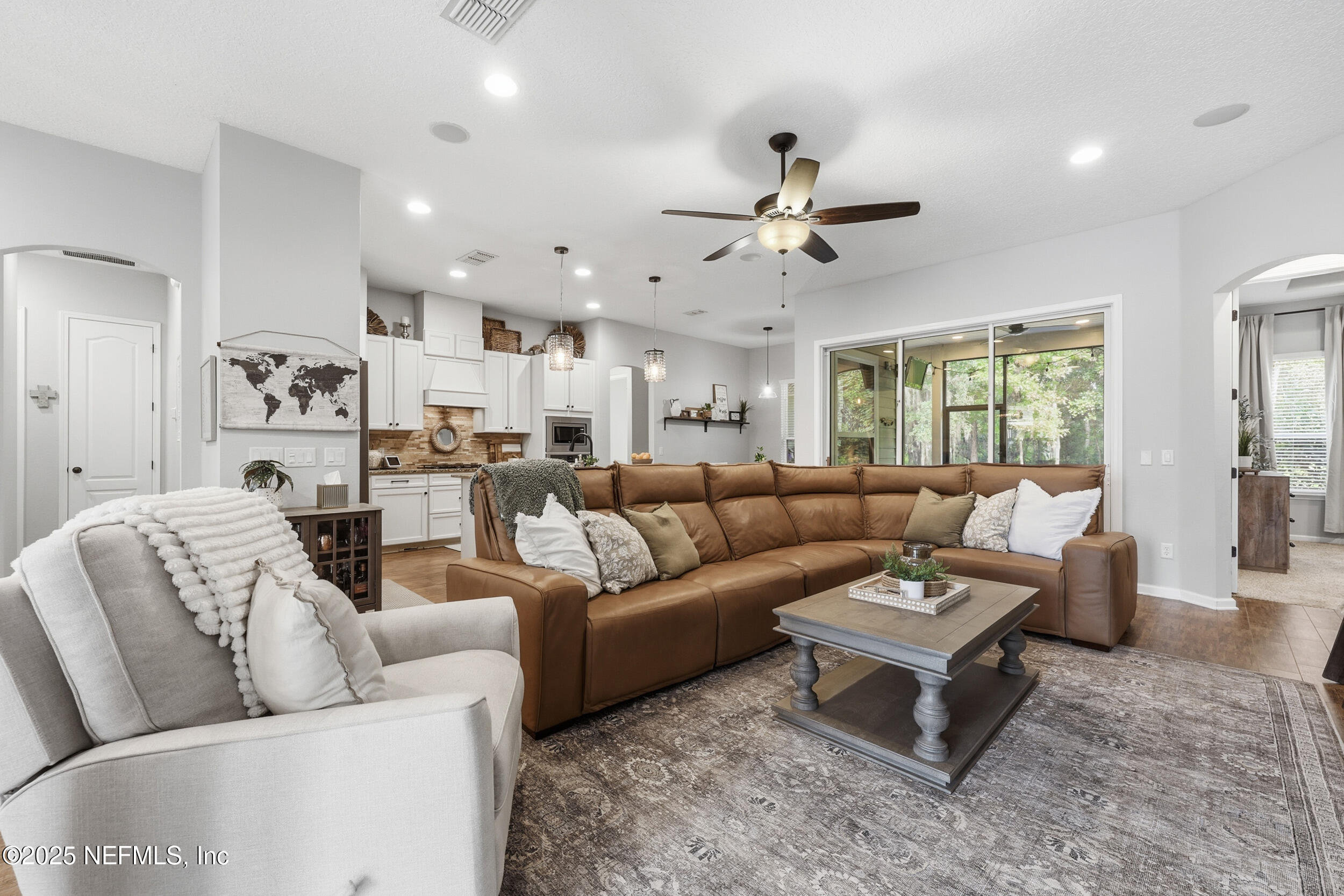 50 Olivette Street St. Johns, FL 32259 - Photo 10 of 74 a living room with furniture ceiling fan and a rug