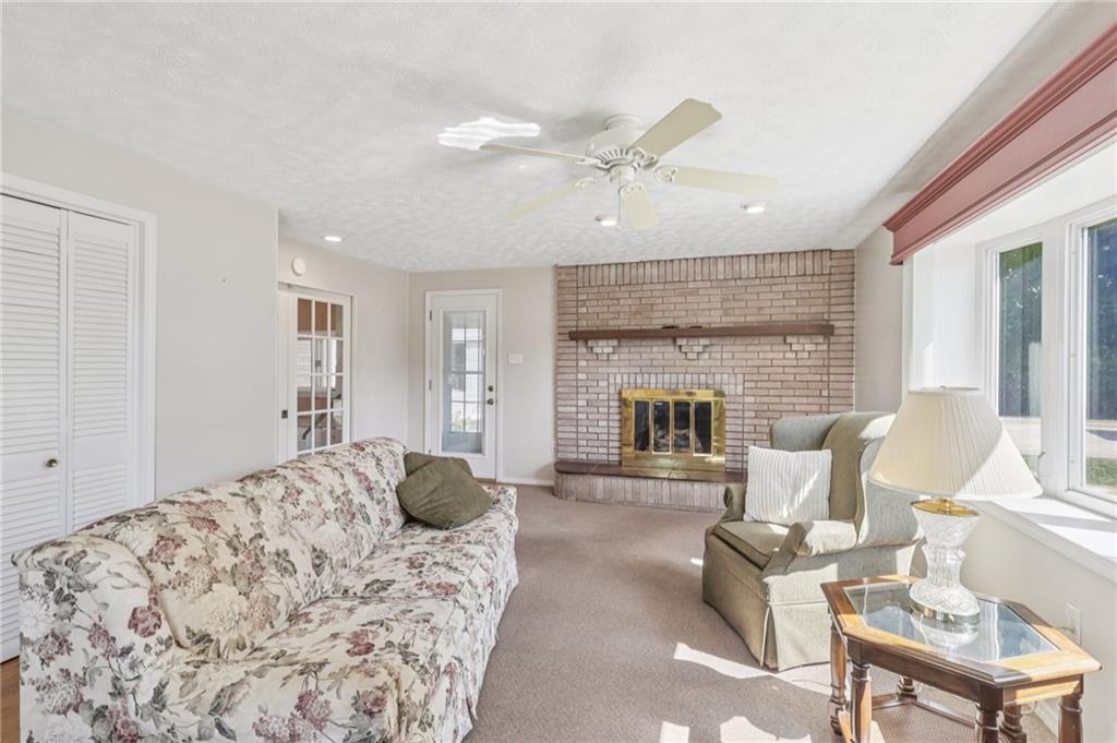 807 Kaye Avenue Monaca, PA 15061 - Photo 11 of 41 a spacious bedroom with a balcony a bed and a fireplace