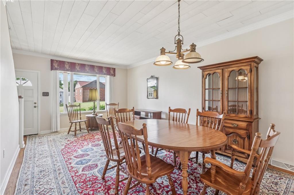 807 Kaye Avenue Monaca, PA 15061 - Photo 12 of 41 a dining room with furniture a chandelier and window