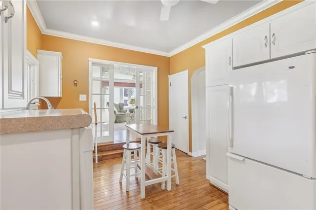 a kitchen with counter top space and windows