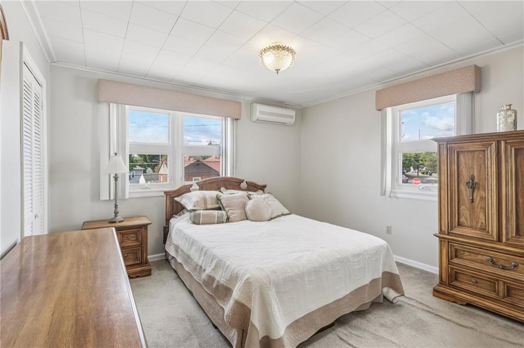 807 Kaye Avenue Monaca, PA 15061 - Photo 22 of 41 a bedroom with a bed and wooden floor