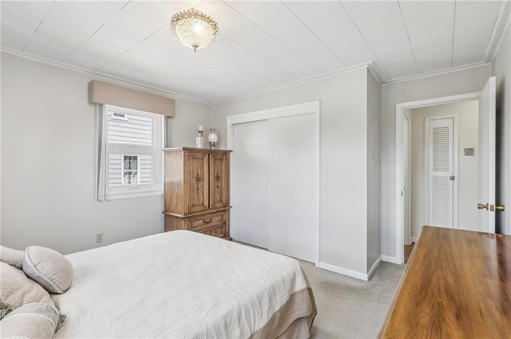 807 Kaye Avenue Monaca, PA 15061 - Photo 24 of 41 a bedroom with a bed and wooden floor