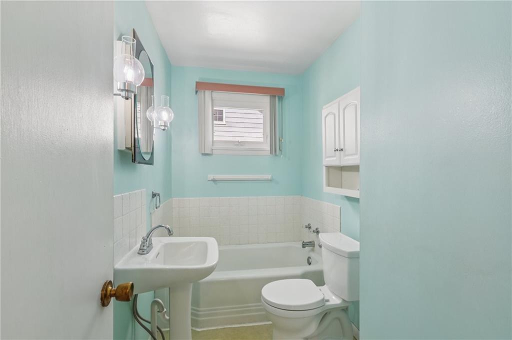 807 Kaye Avenue Monaca, PA 15061 - Photo 25 of 41 a bathroom with a sink toilet and mirror