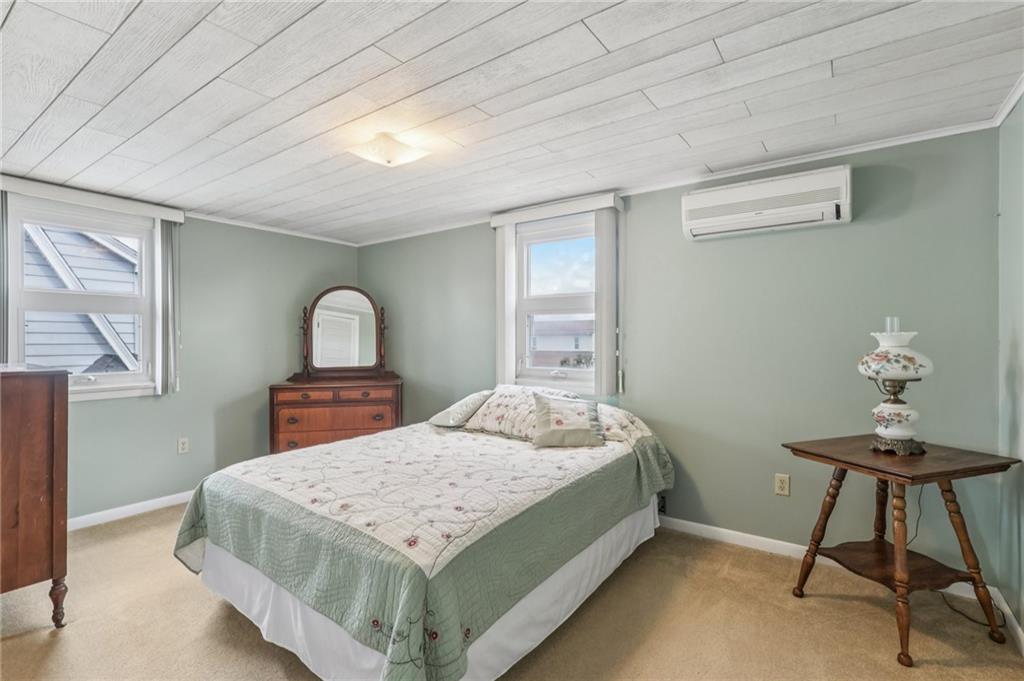 807 Kaye Avenue Monaca, PA 15061 - Photo 26 of 41 a bedroom with a bed and a chandelier