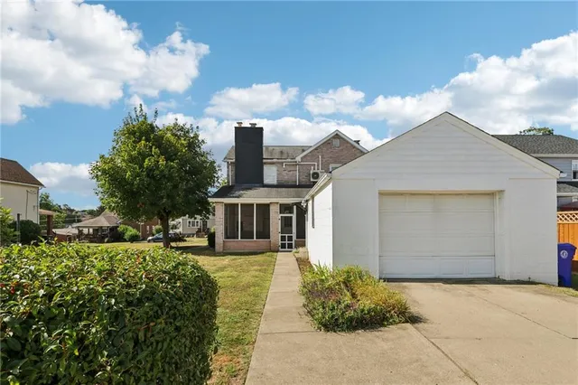 a house view with a garden space