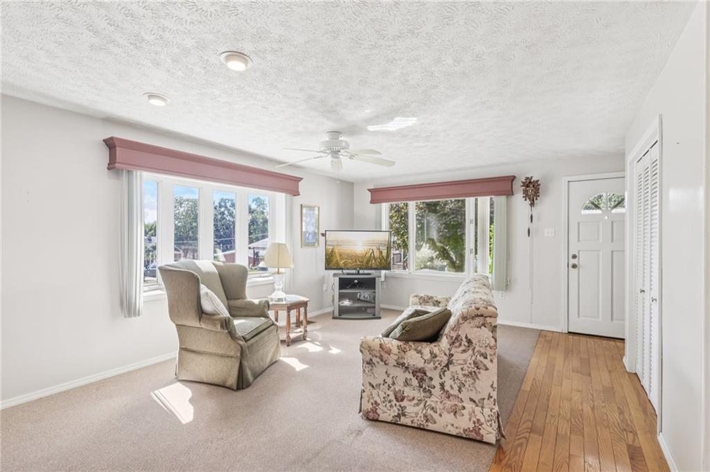 807 Kaye Avenue Monaca, PA 15061 - Photo 9 of 41 a living room with furniture large window and wooden floor