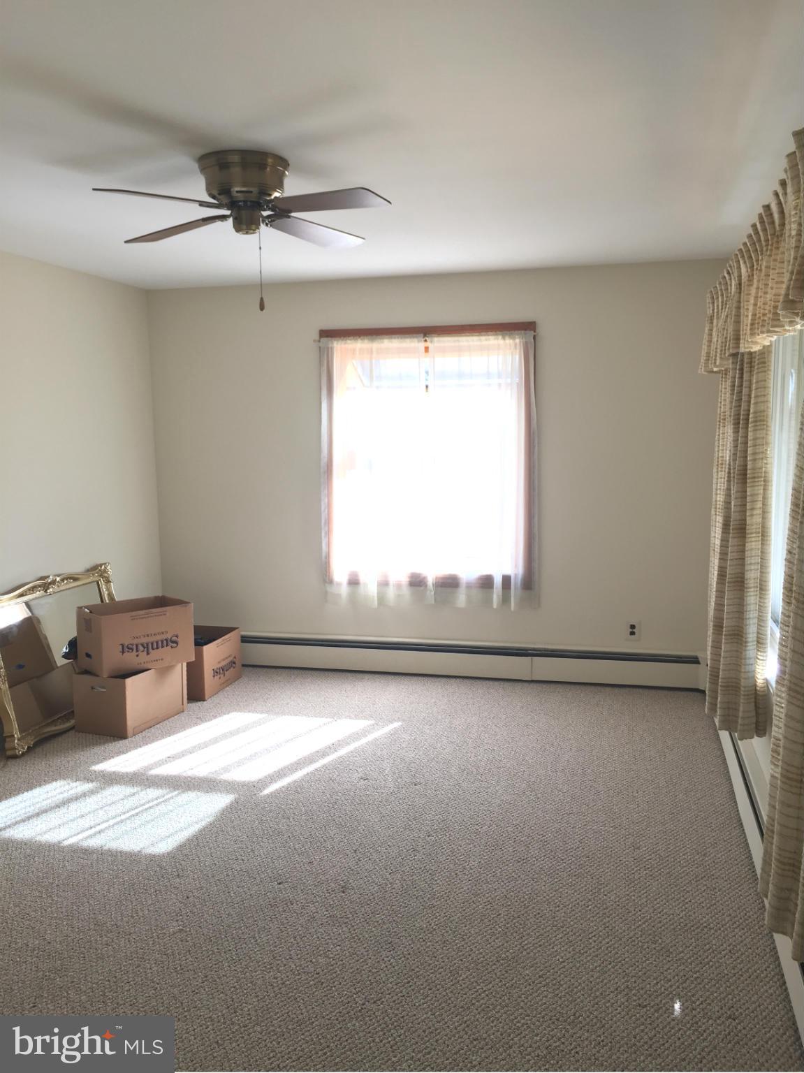 3025 Ridge Road Baltimore, MD 21244 - Photo 3 of 27 an empty room with windows