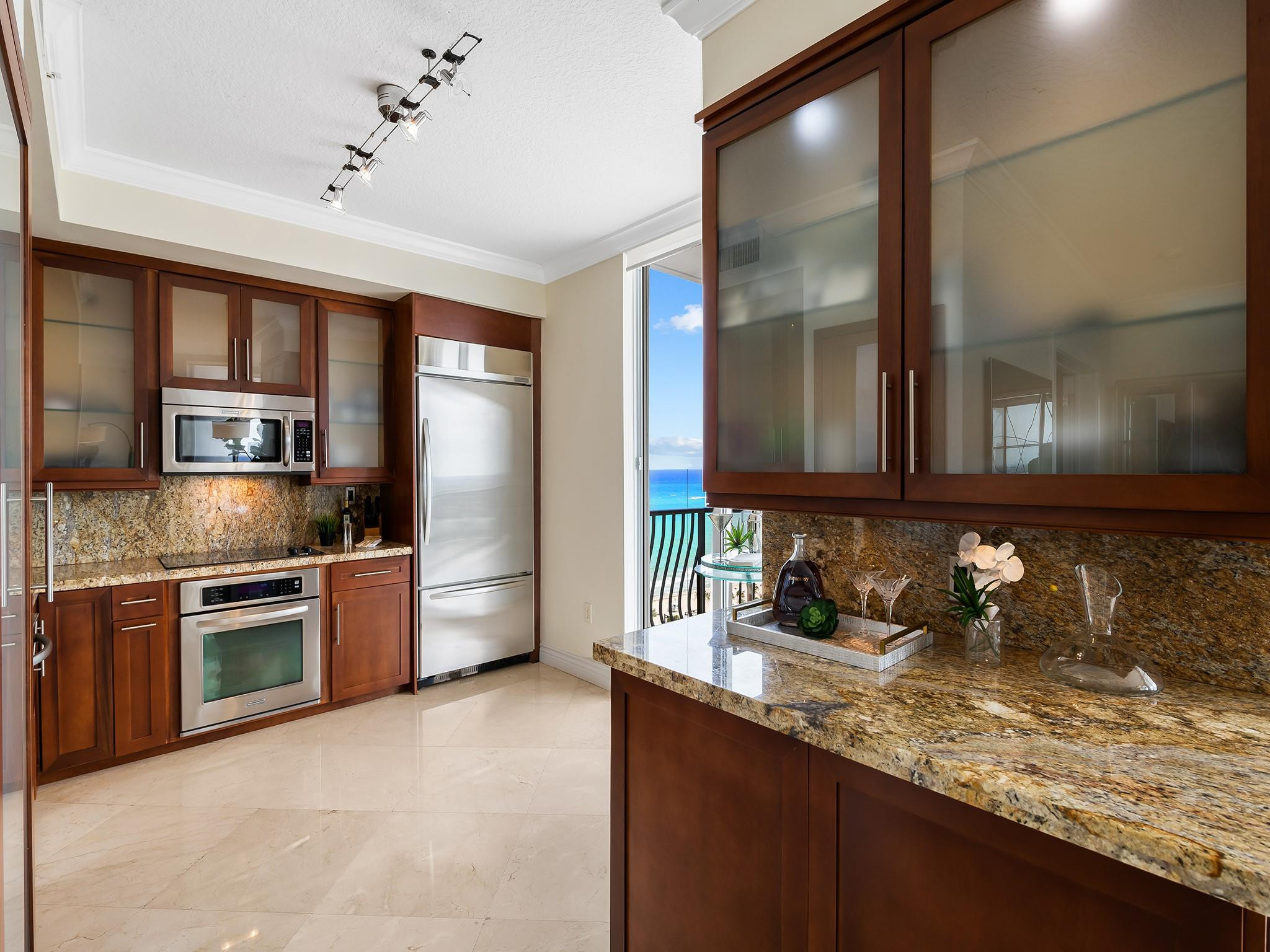 100 South Birch Road, Unit 2504 Fort Lauderdale, FL 33316 - Photo 12 of 42 a kitchen with stainless steel appliances granite countertop a sink stove and refrigerator