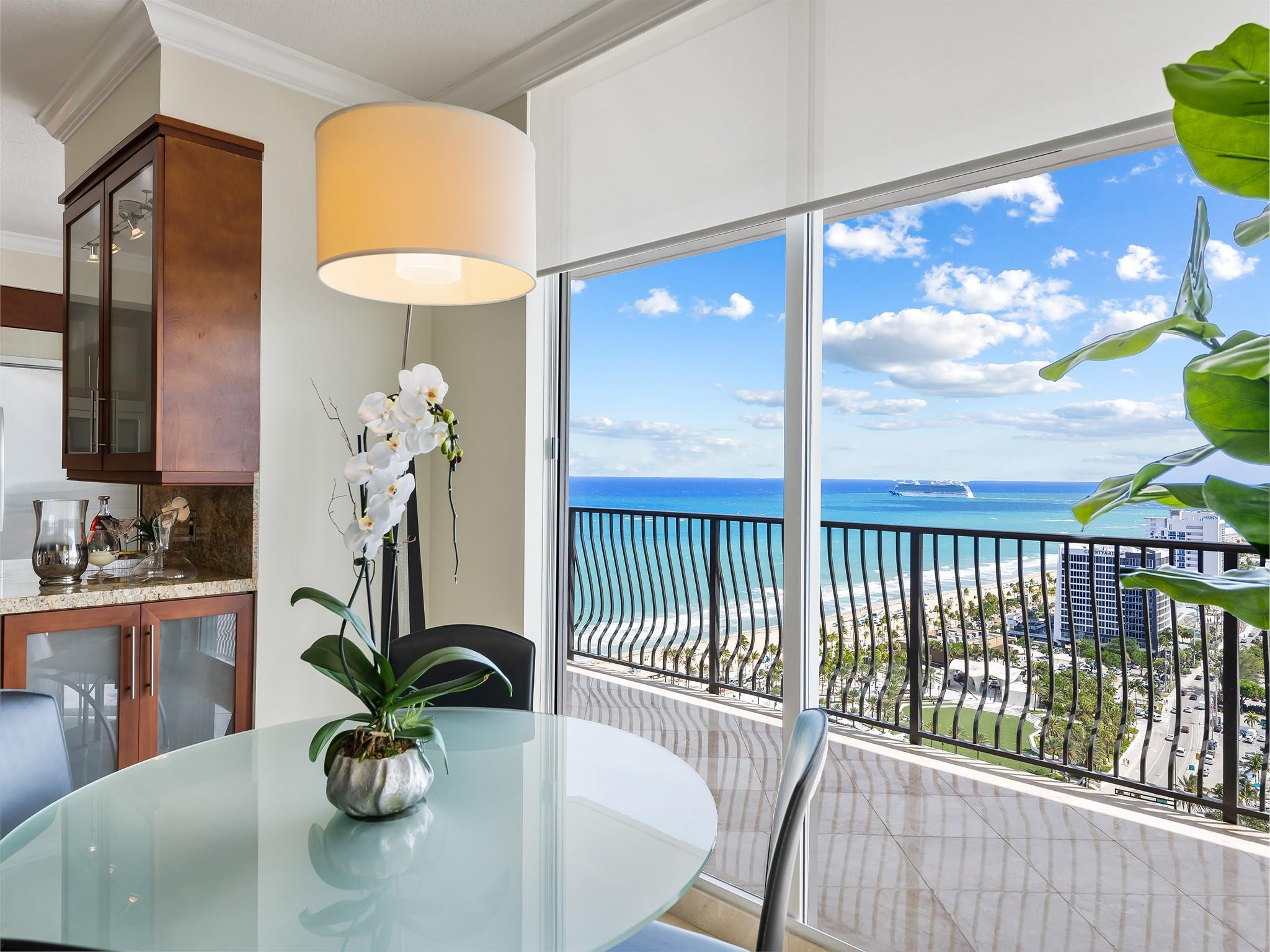 100 South Birch Road, Unit 2504 Fort Lauderdale, FL 33316 - Photo 14 of 42 a dining room with furniture and a floor to ceiling window