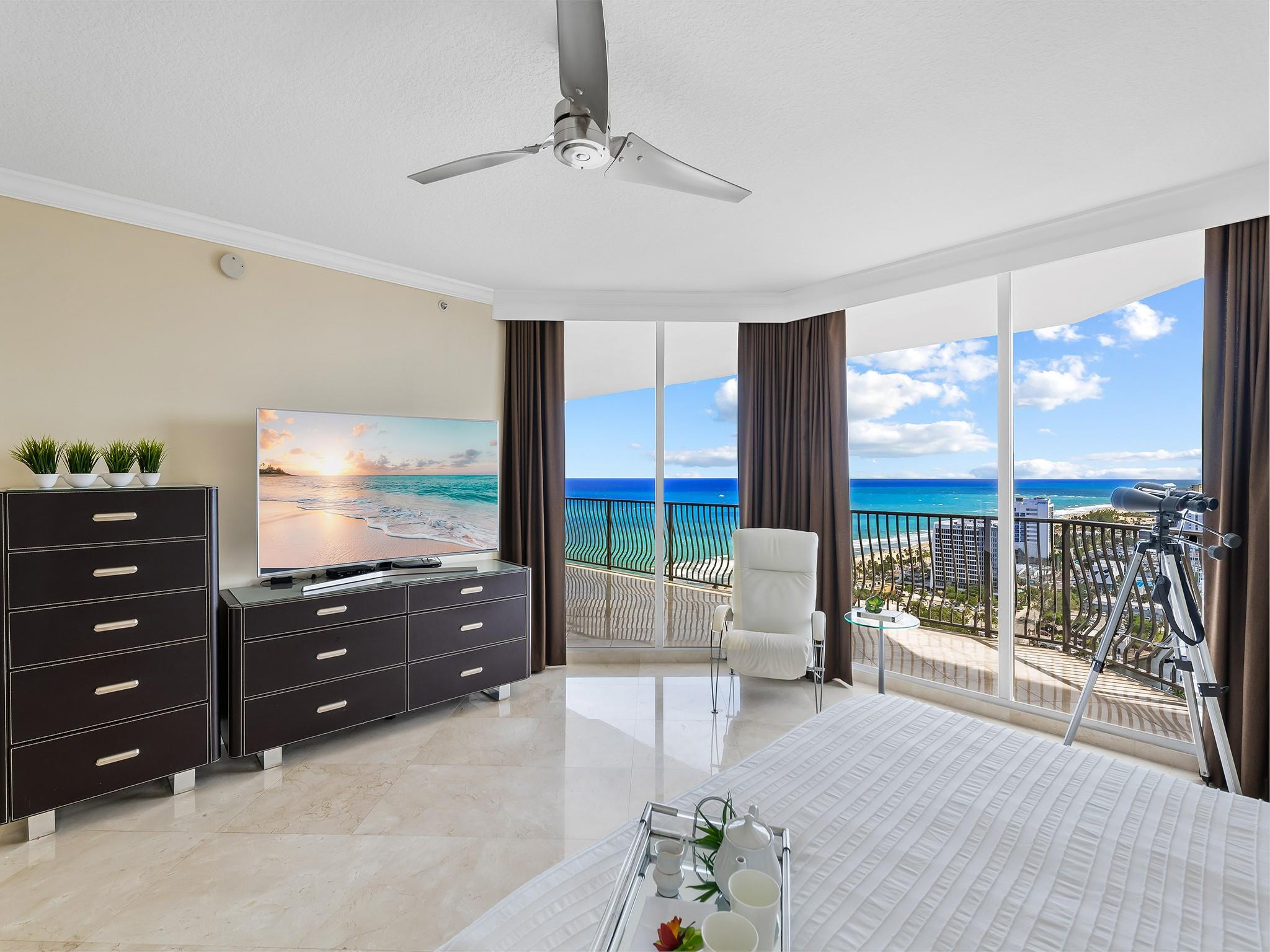 100 South Birch Road, Unit 2504 Fort Lauderdale, FL 33316 - Photo 15 of 42 a room with a bed and large windows