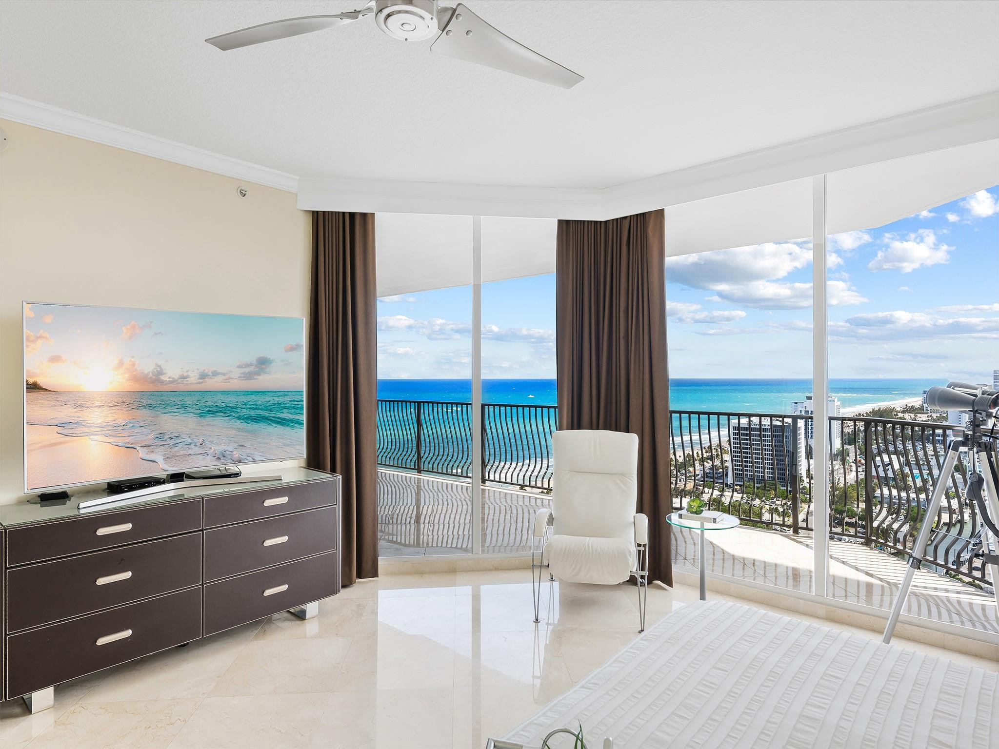 100 South Birch Road, Unit 2504 Fort Lauderdale, FL 33316 - Photo 16 of 42 a living room with furniture and large windows