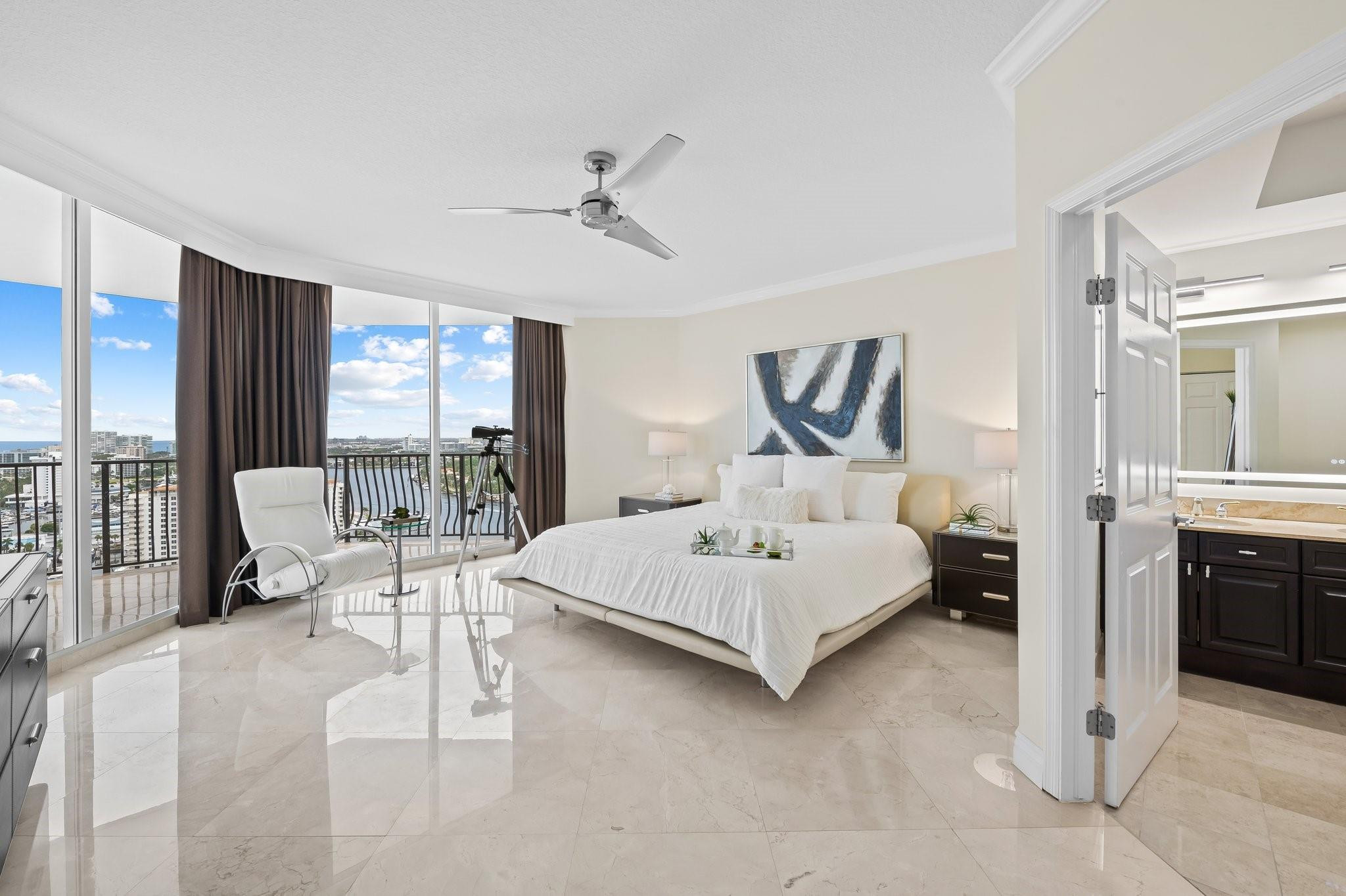 100 South Birch Road, Unit 2504 Fort Lauderdale, FL 33316 - Photo 19 of 42 a bedroom with a bed couch and large window