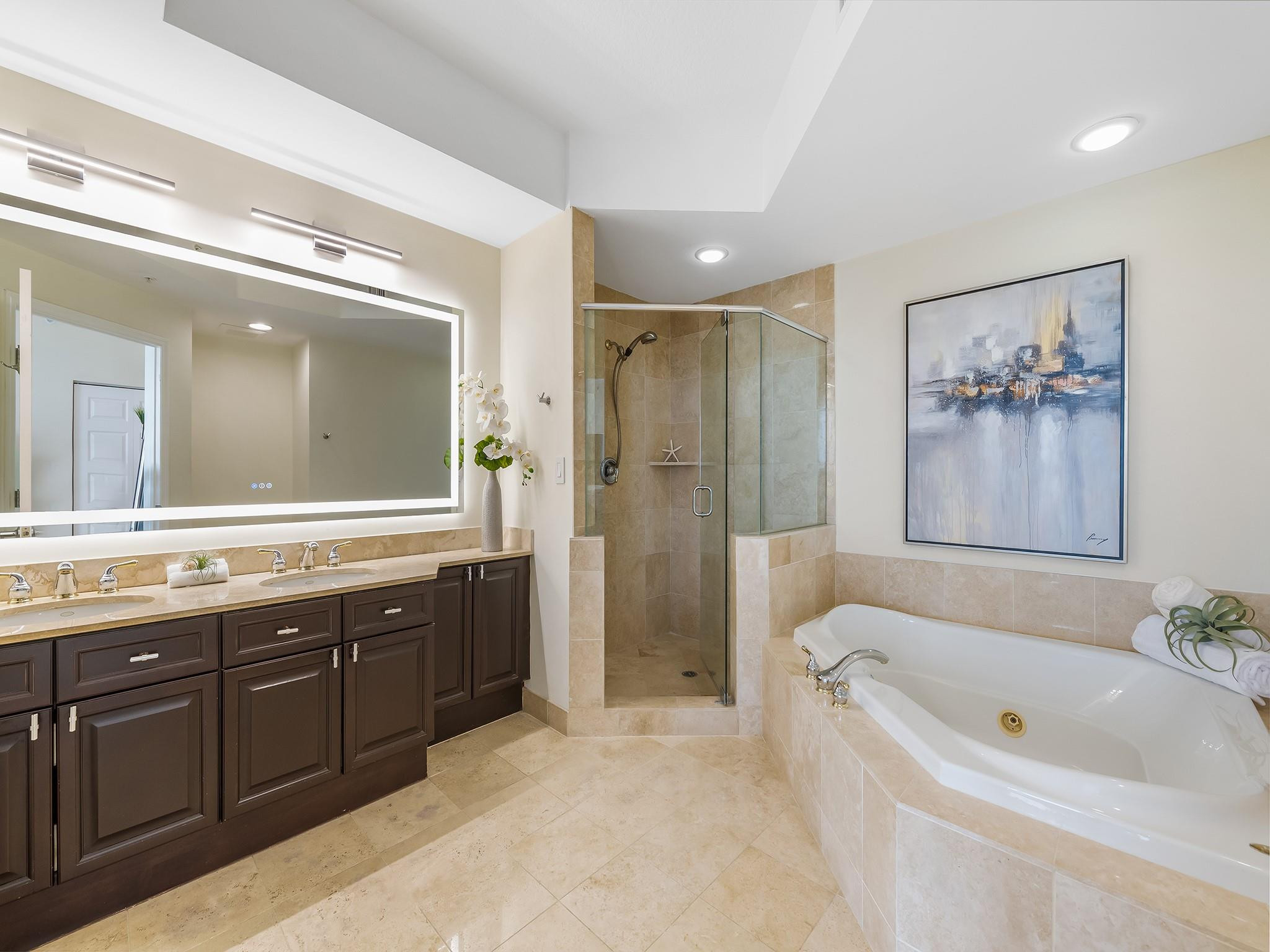 100 South Birch Road, Unit 2504 Fort Lauderdale, FL 33316 - Photo 20 of 42 a bathroom with a tub a sink shower and mirror