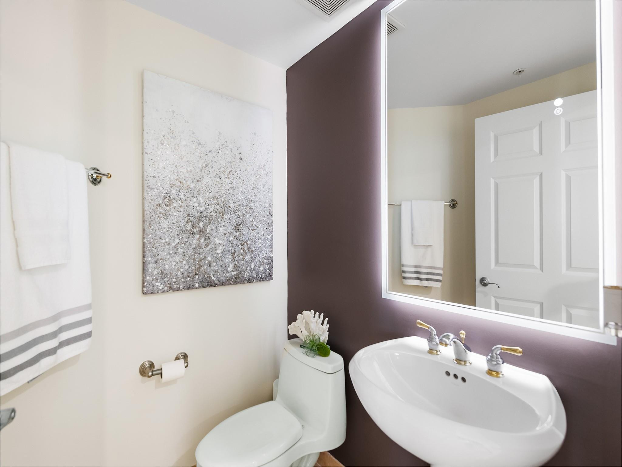 100 South Birch Road, Unit 2504 Fort Lauderdale, FL 33316 - Photo 22 of 42 a bathroom with a sink a toilet and shower