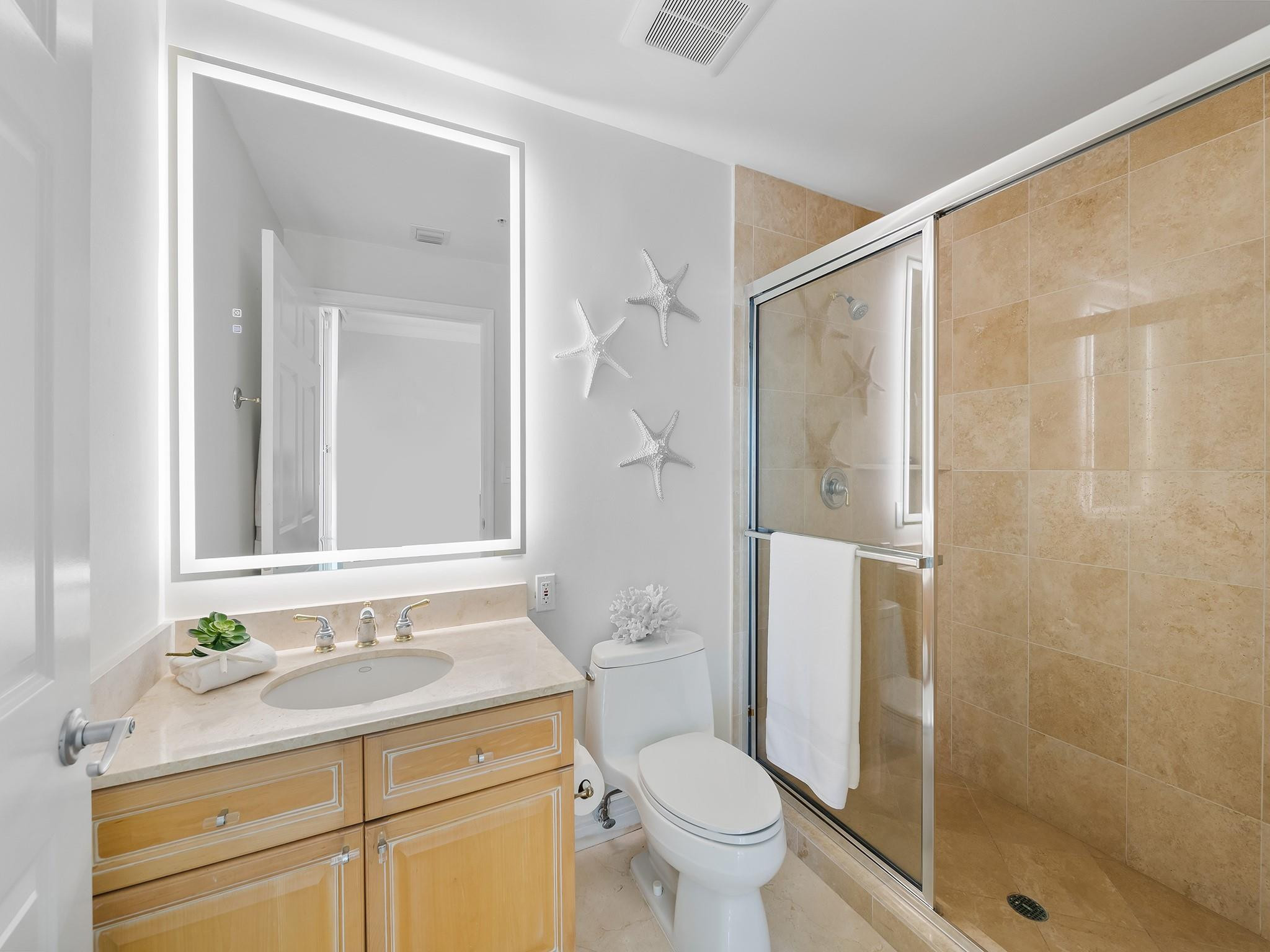 100 South Birch Road, Unit 2504 Fort Lauderdale, FL 33316 - Photo 25 of 42 a bathroom with a granite countertop sink toilet and shower