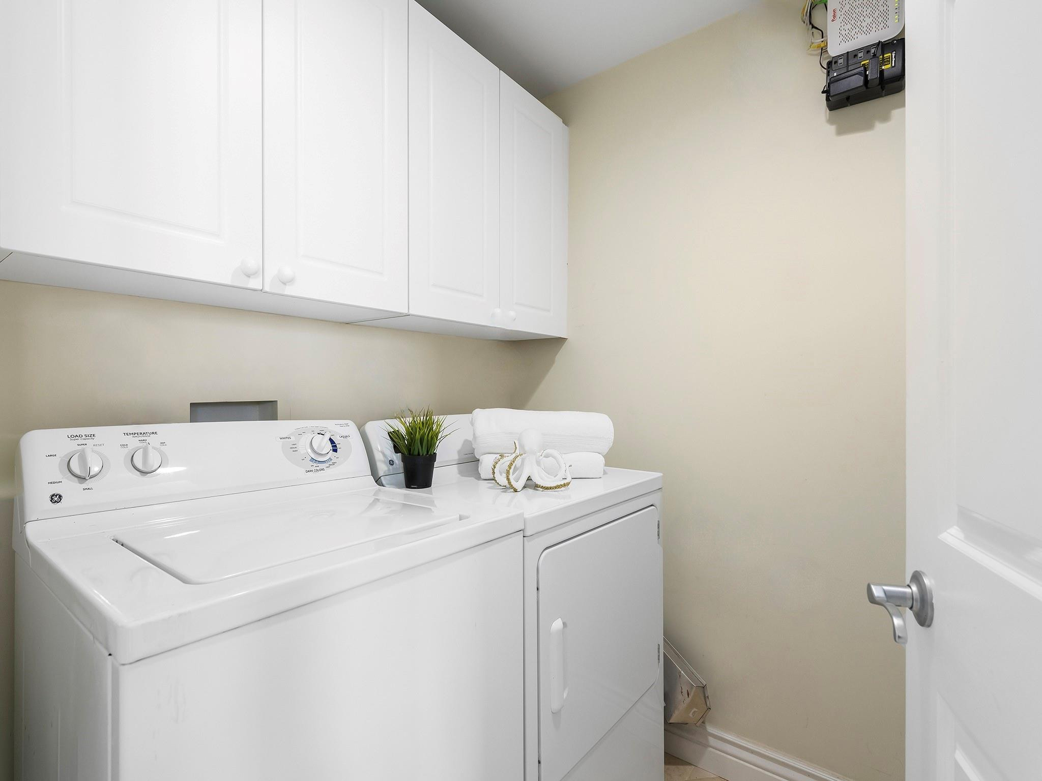 100 South Birch Road, Unit 2504 Fort Lauderdale, FL 33316 - Photo 26 of 42 a utility room with dryer and washer