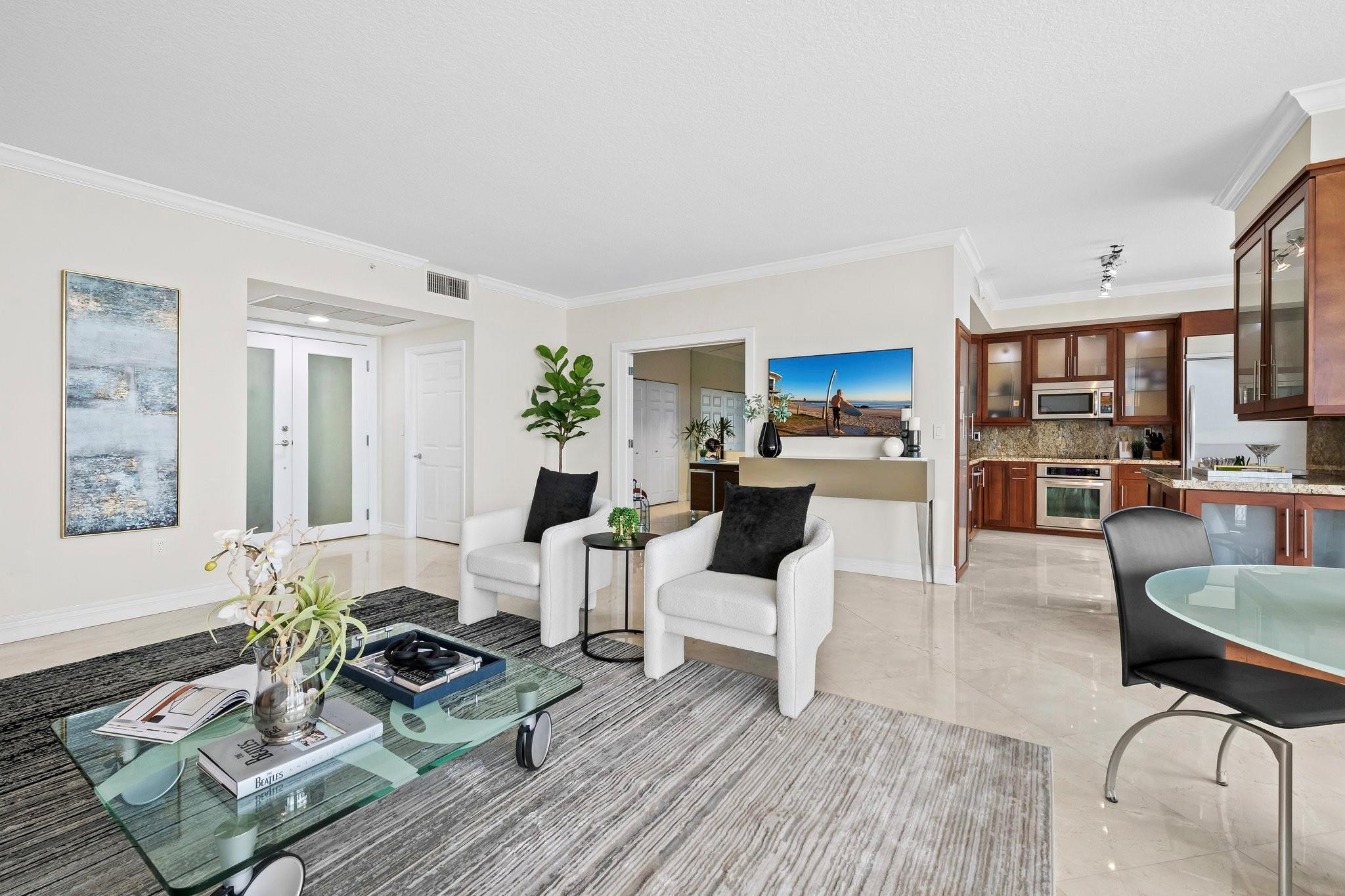 100 South Birch Road, Unit 2504 Fort Lauderdale, FL 33316 - Photo 8 of 42 a living room with furniture and a wooden floor