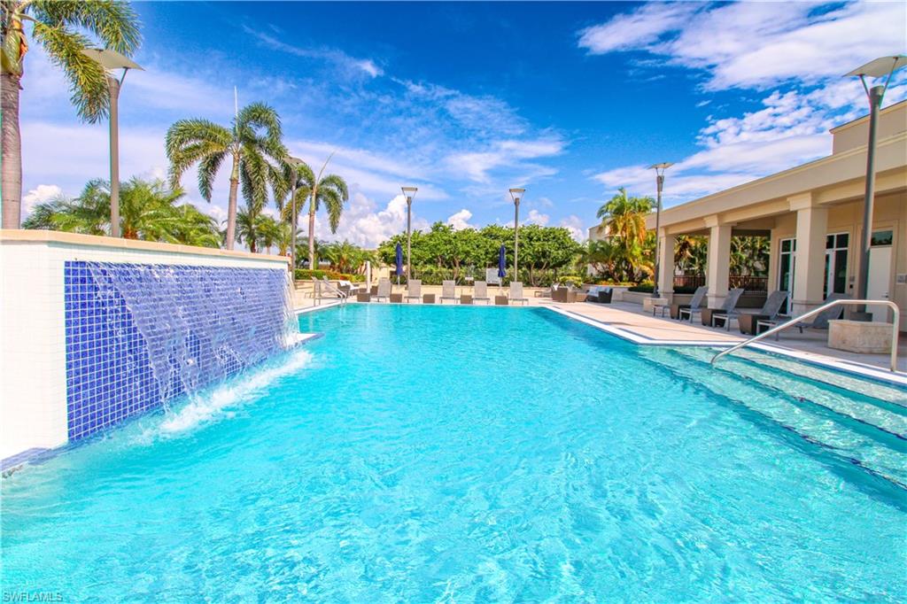 9123 Strada Place, Unit 7410 Naples, FL 34108 - Photo 1 of 50 View of pool featuring a patio area and pool water feature