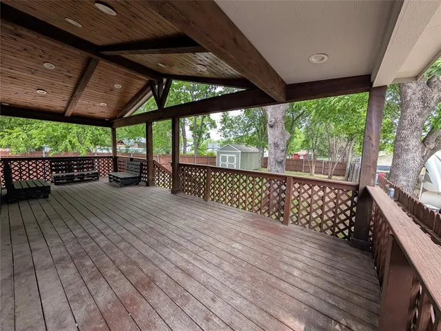 a view of outdoor space with wooden floor