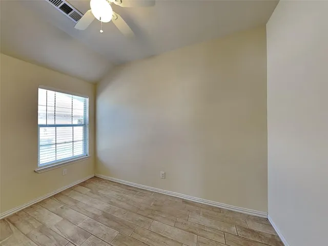 an empty room with a empty space and windows