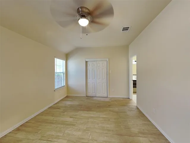 a view of an empty room and window