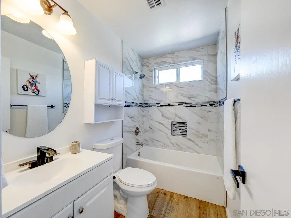 2922 Luana Drive Oceanside, CA 92056 - Photo 15 of 28 a bathroom with a sink a toilet and bathtub
