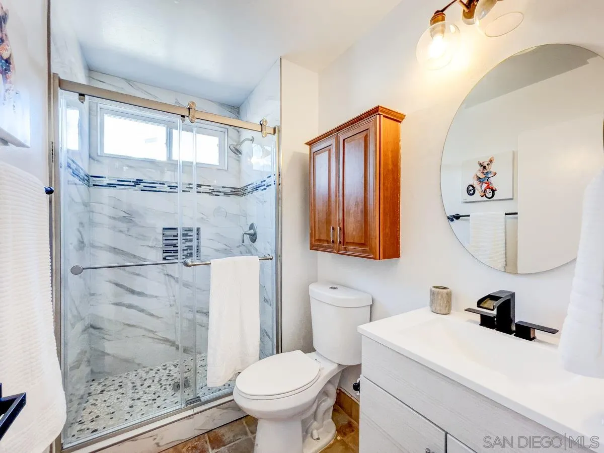 2922 Luana Drive Oceanside, CA 92056 - Photo 17 of 28 a bathroom with a sink toilet and shower