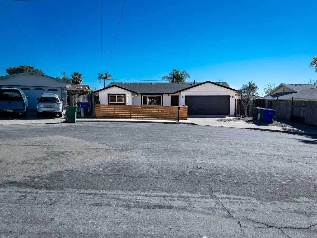 2922 Luana Drive Oceanside, CA 92056 - Photo 24 of 28 a view of a house with a yard and car parked in front of it