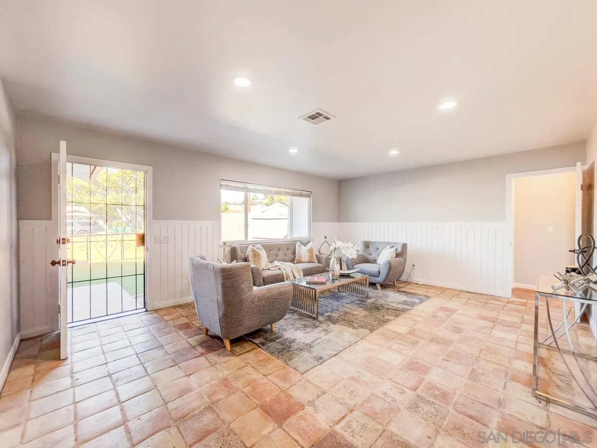 2922 Luana Drive Oceanside, CA 92056 - Photo 5 of 28 a living room with furniture and a flat screen tv