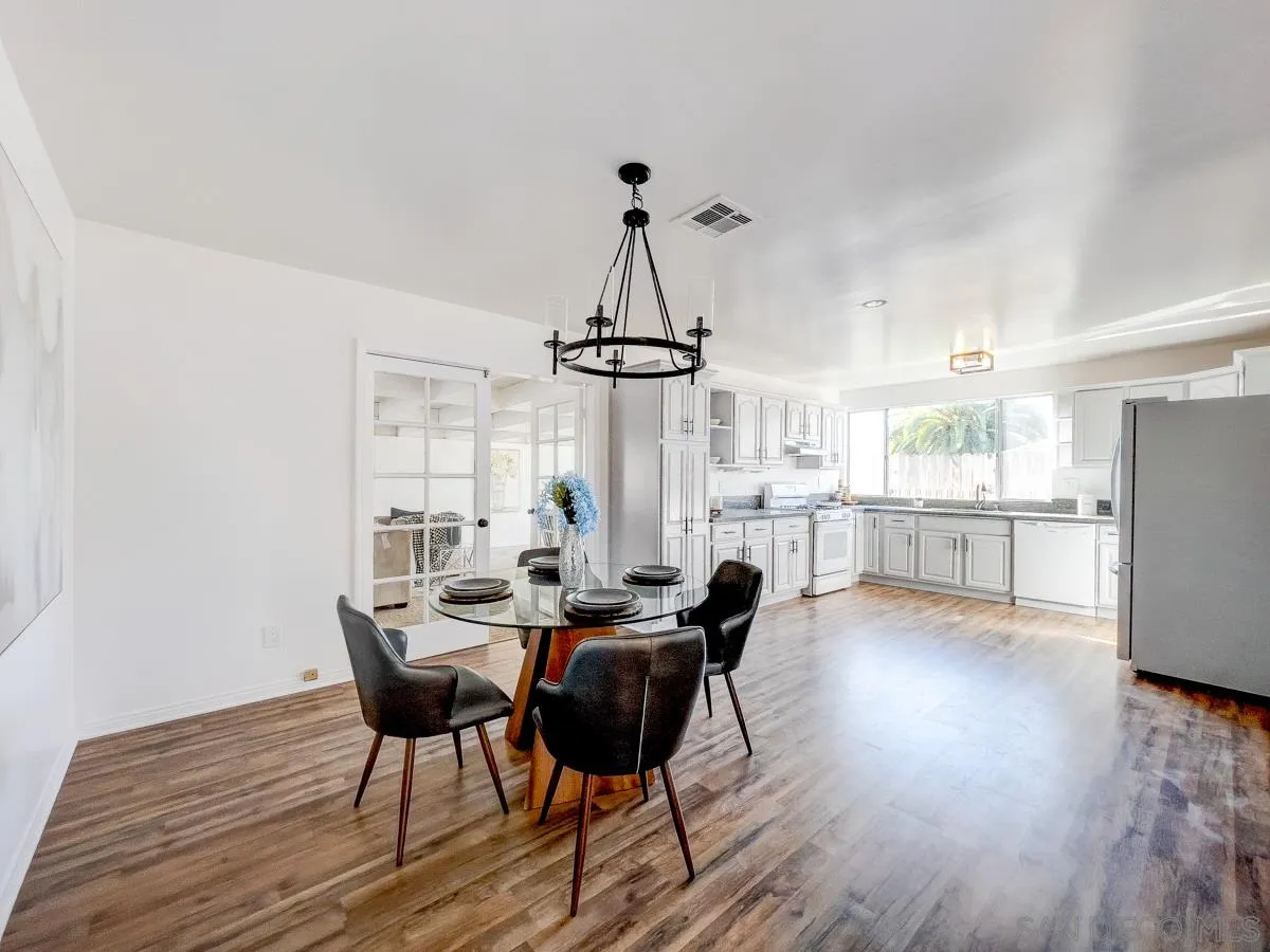 2922 Luana Drive Oceanside, CA 92056 - Photo 7 of 28 a view of a dining room with furniture window and wooden floor