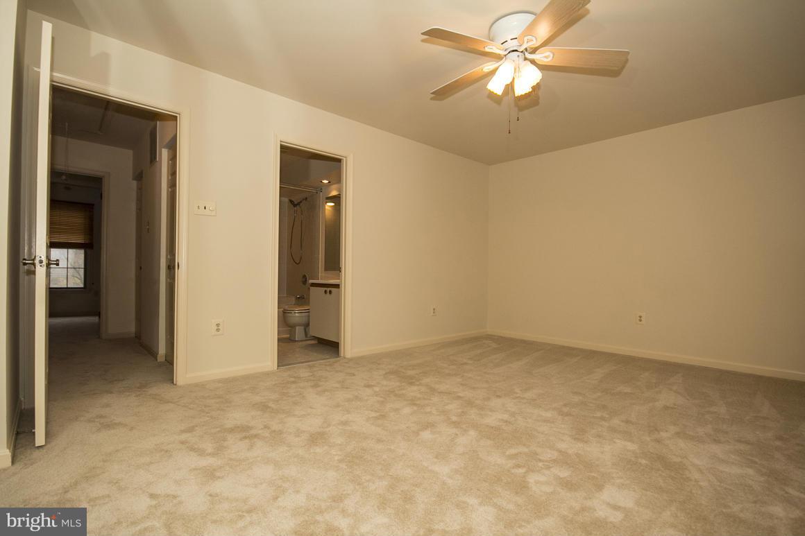27 Rhodes Place Lutherville-Timonium, MD 21093 - Photo 13 of 19 a view of an empty room and chandelier fan