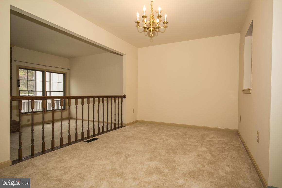 27 Rhodes Place Lutherville-Timonium, MD 21093 - Photo 4 of 19 a view of a livingroom with a chandelier