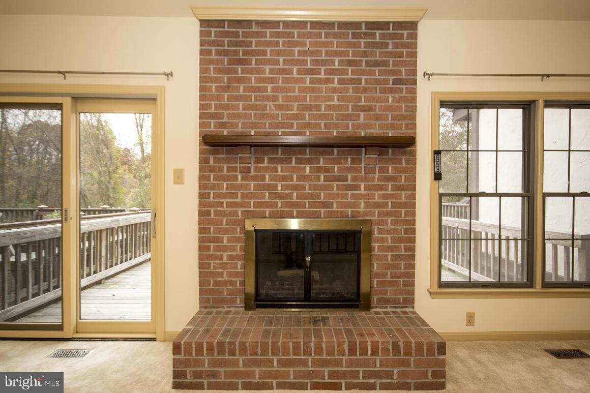 27 Rhodes Place Lutherville-Timonium, MD 21093 - Photo 8 of 19 a bedroom with a bed and a fireplace