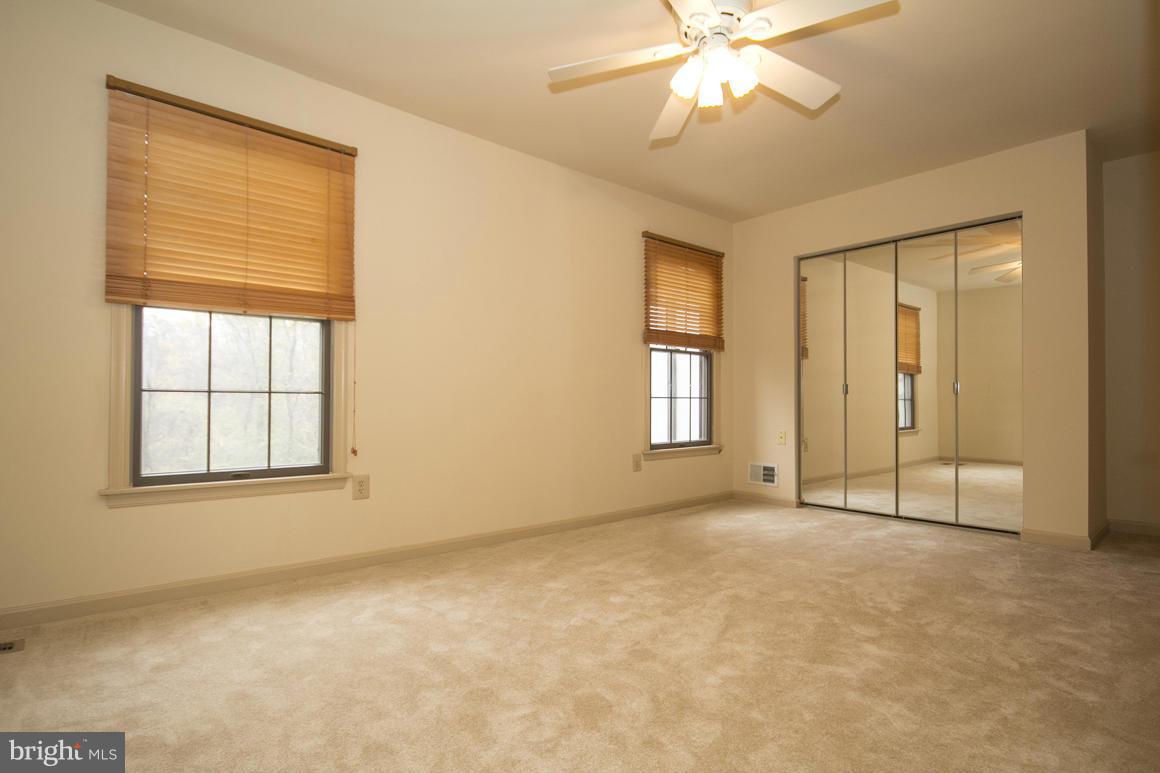 27 Rhodes Place Lutherville-Timonium, MD 21093 - Photo 9 of 19 an empty room with windows and fan