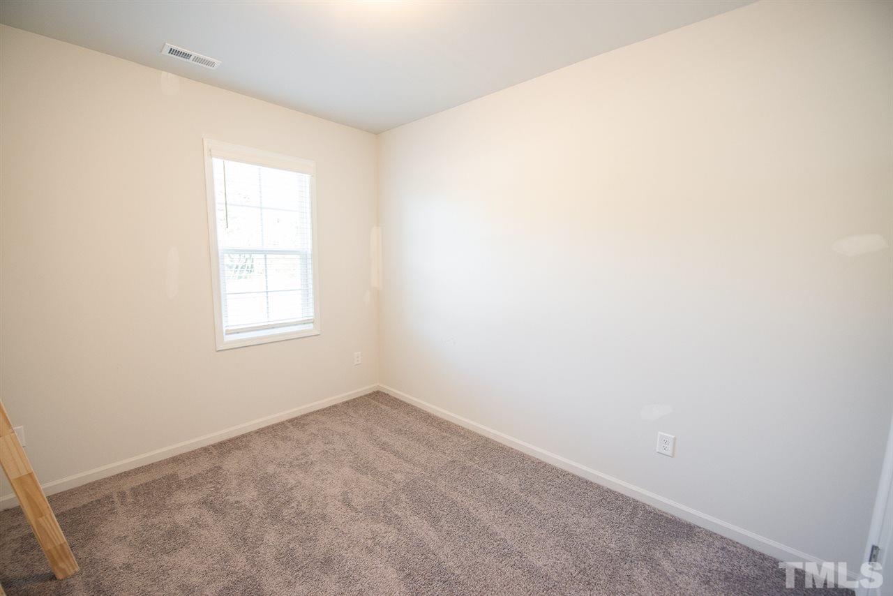 3620 Buffaloe Road, Unit 1 Raleigh, NC 27604 - Photo 16 of 25 an empty room with a window
