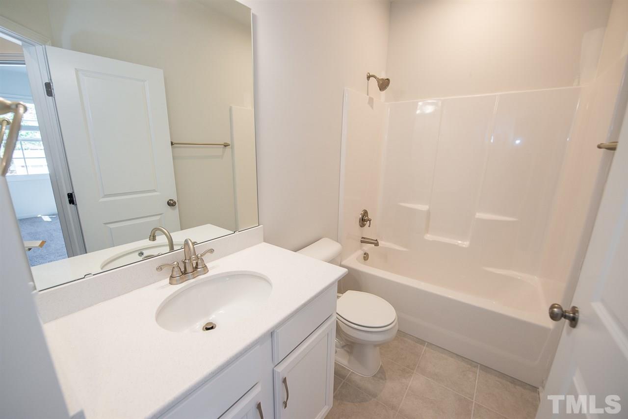 3620 Buffaloe Road, Unit 1 Raleigh, NC 27604 - Photo 17 of 25 a bathroom with a sink toilet and shower