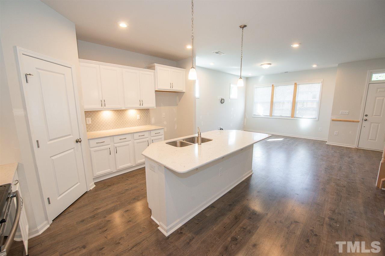 3620 Buffaloe Road, Unit 1 Raleigh, NC 27604 - Photo 4 of 25 a kitchen with a sink window and cabinets