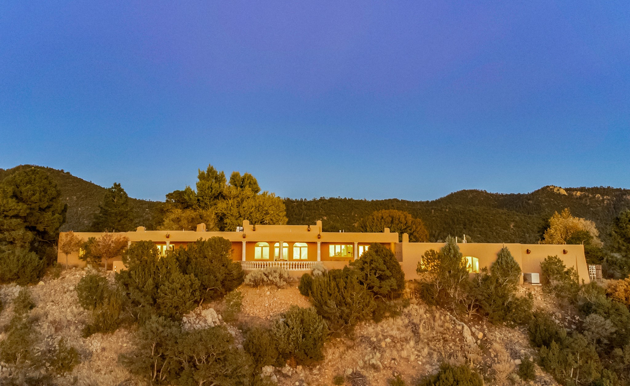 243 Double Arrow Road Santa Fe, NM 87505 - Photo 43 of 43 Aerial View of Home At Sunset
